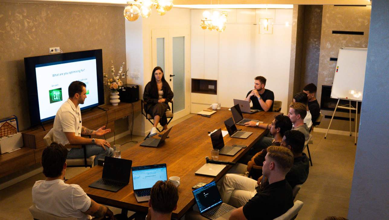 Romans Ivanovs and Kristina running a session at the BGG Agency Mastermind, working through team structure with the cohort